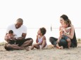 Interracial Family Relaxing On The Beach British Columbia Canada PUBLICATIONxINxGERxSUIxAUTxONLY C