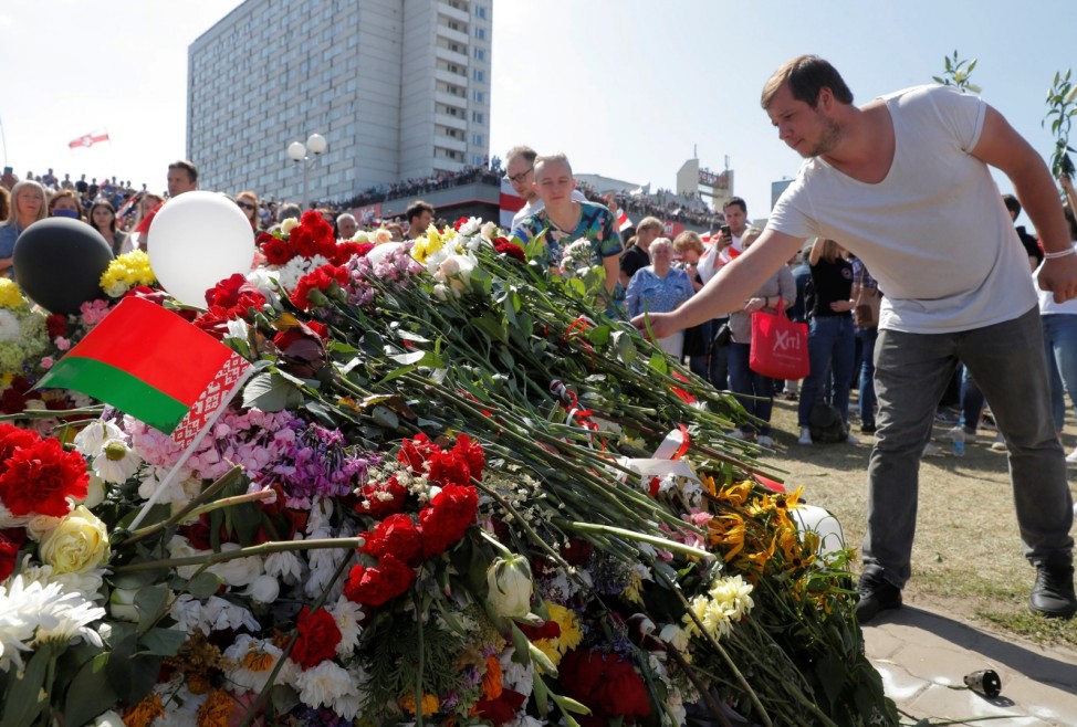 People gather to commemorate a killed protester in Minsk