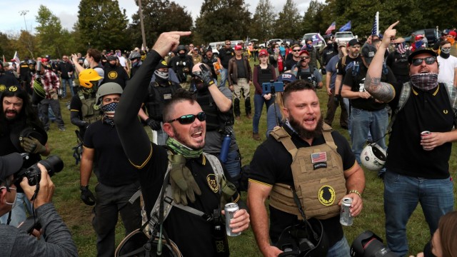 Men shout slogans and gesture during a rally of the far right group Proud Boys, in Portland