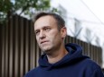 FILE PHOTO: Russian opposition leader Navalny speaks with journalists outside a detention centre in Moscow