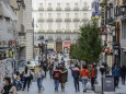 October 4, 2020, Madrid, Spain: People wearing face masks as a preventive measure walk on the street..The coronavirus c