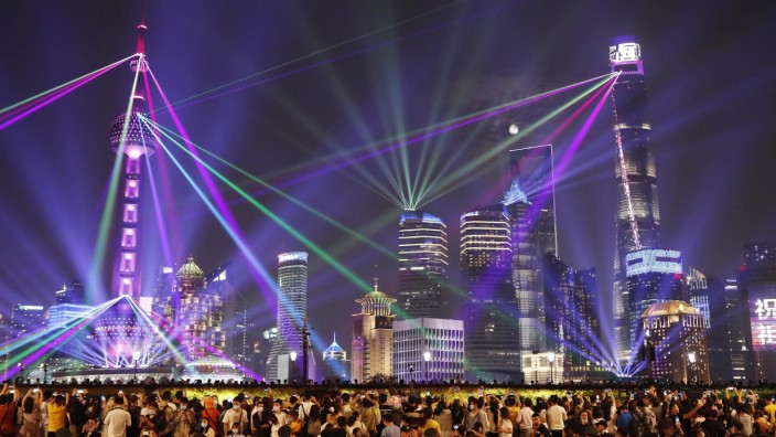 SHANGHAI, CHINA - OCTOBER 01: Buildings at the Lujiazui Financial Centre are illuminated during a light show to celebra
