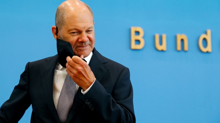 FILE PHOTO: German Finance Minister Olaf Scholz presents the federal government's 2021 draft budget, in Berlin