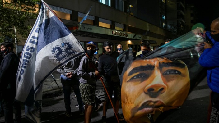 Supporters of former Argentine soccer player Diego Maradona remain outside the Ipensa clinic pending his health after h