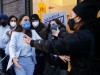 Congresswoman Alexandria Ocasio-Cortez hugs State Senator Alessandra Biaggi when she thanks her campaign team outside o