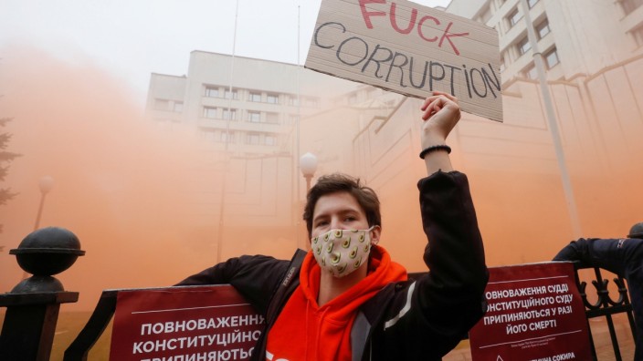 A protester takes part in a rally outside the Constitutional Court building in Kyiv