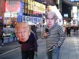 NEW YORK, NY - NOVEMBER 03: People wearing masks of U.S. President Donald Trump and Democratic nominee Joe Biden walk a