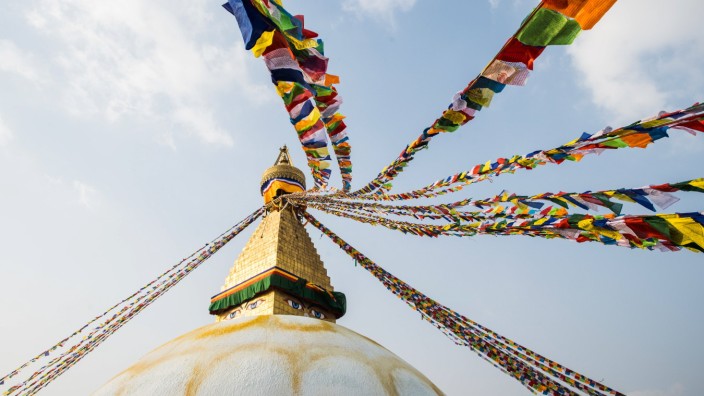 The Buddha Stupa strung with Prayer flags in Kathmandu Nepal Kathmandu, Central Development Region, Nepal PUBLICATIONxIN