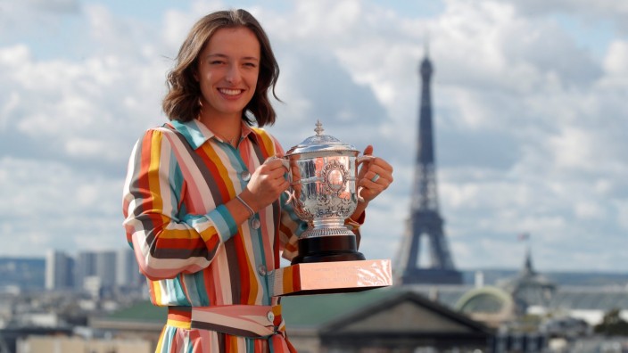 FILE PHOTO: Poland's Iga Swiatek poses with the trophy after winning the French Open