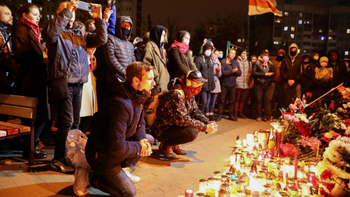 People gather to mourn the death of anti-government protester Roman Bondarenko in Minsk