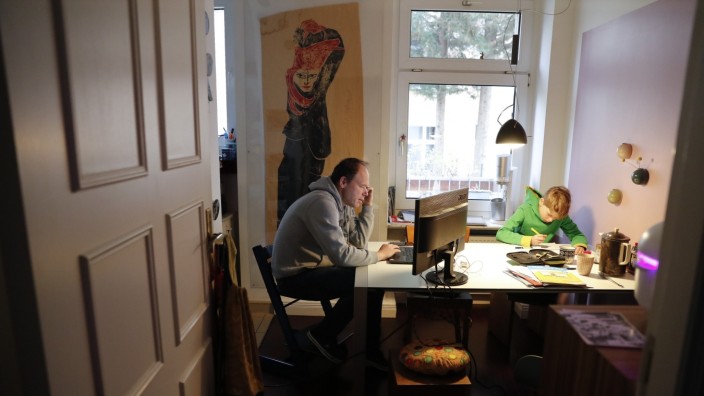 Holger Frohnmeyer studies with his son Rasmus at home during the spread of coronavirus disease (COVID-19) in Berlin