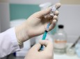 KAZAN, RUSSIA - DECEMBER 15, 2020: A nurse prepares the Gam-COVID-Vak (Sputnik V) vaccine for vaccination of medical wo