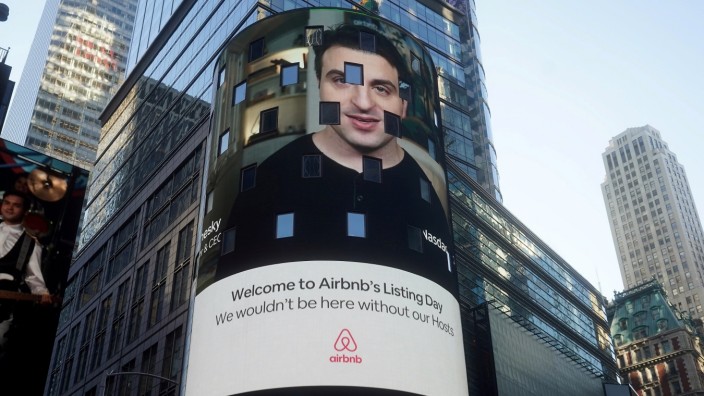 FILE PHOTO: The Nasdaq market site displays an Airbnb sign featuring CEO Brian Chesky on their billboard on the day of their IPO in Times Square