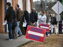 December 30, 2020, Canton, GA, USA: Early voters in North Georgia brasher the damp cold to queue for more than an hour