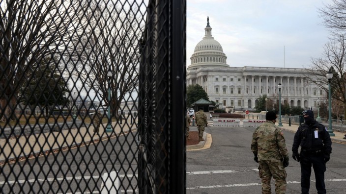 U.S. Capitol Police and National Guardsmen stand at an entrance to the Capitol in Washington