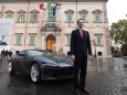 Fiat Chrysler chairman John Elkann poses next to the new Ferrari Roma outside the Quirinale Presidential Palace in Rome