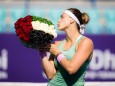 January 13, 2021, Abu Dhabi, UNITED ARAB EMIRATES: Aryna Sabalenka of Belarus poses with flowers after winning the fina