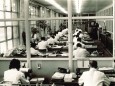 Employees in large office of Salamander Company 1960 nostalgic