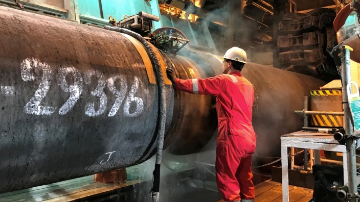 FILE PHOTO: A specialist works onboard the Allseas' deep sea pipe laying ship Solitaire to prepare a pipe for Nord Stream 2 pipeline in the Baltic Sea
