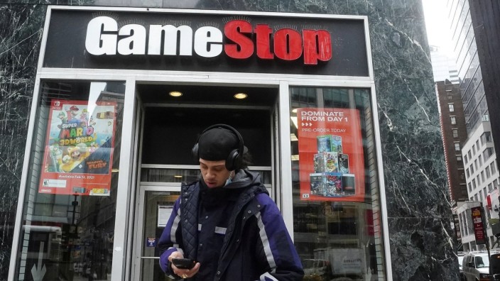 FILE PHOTO: A Fedex deliveryman prepares a package for a GameStop store in New York