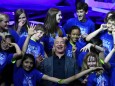 FILE PHOTO: Founder, Chairman, CEO and President of Amazon Jeff Bezos poses with children from 'Club for the Future' after his space company Blue Origin's space exploration lunar lander rocket called Blue Moon was unveiled at an event in Washington
