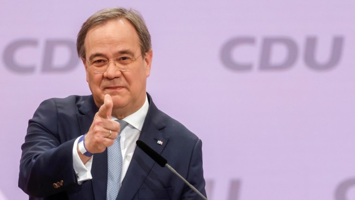 FILE PHOTO: Armin Laschet, the new leader of Germany's Christian Democratic Union, gestures as he delivers a speech to a CDU conference in Berlin