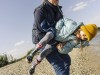 Father carrying daughter while enjoying near river bank model released Symbolfoto GUSF04457