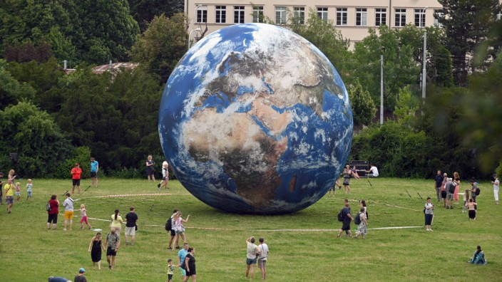 A giant inflatable model of the planet Earth exhibited by the Brno Observatory and Planetarium is seen on the Peace Squa