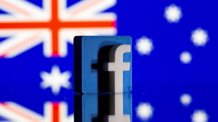 FILE PHOTO: A 3D-printed Facebook logo is seen in front of a displayed Australian flag in this illustration photo