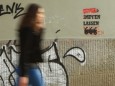 Corona-Impfung: Graffiti "Impfen lassen" an einer Hauswand in Hamburg