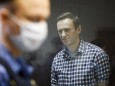 FILE PHOTO: Russian opposition politician Alexei Navalny attends a hearing hearing to consider an appeal against an earlier court decision to change his suspended sentence to a real prison term