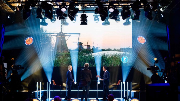 PVV leader Geert Wilders and VVD's Mark Rutte (R) debate during Pauw's election debates on March 11, 2021, in Amsterda