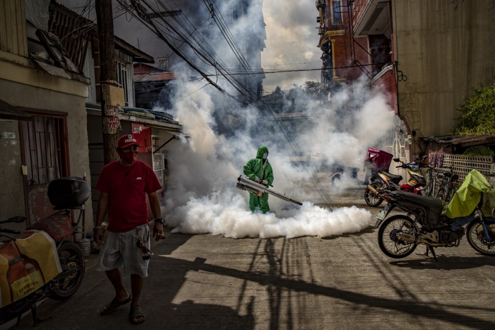 Health Workers Fumigate Manila Slum As Cases Hit Daily Records