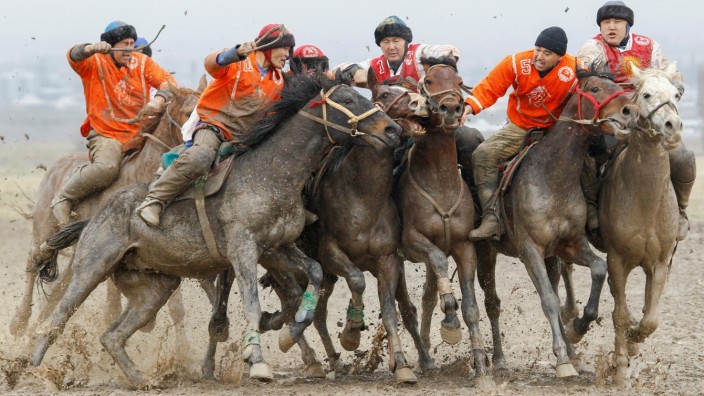 Kyrgyz riders take part in a Kok-Boru regional competition in the village of Sokuluk