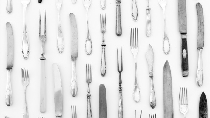 silver cutlery - vintage knife and fork on white background - beautiful decorated table (hanohiki)