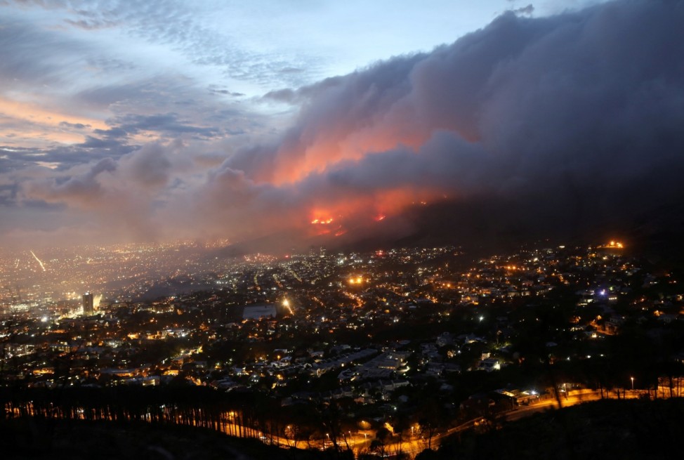 Flames are seen close to the city fanned by strong winds after  a bushfire  broke out on the slopes of Table Mountain in Cape Town