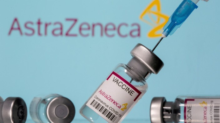 FILE PHOTO: Vials labelled 'Astra Zeneca COVID-19 Coronavirus Vaccine' and a syringe are seen in front of a displayed AstraZeneca logo in this illustration photo