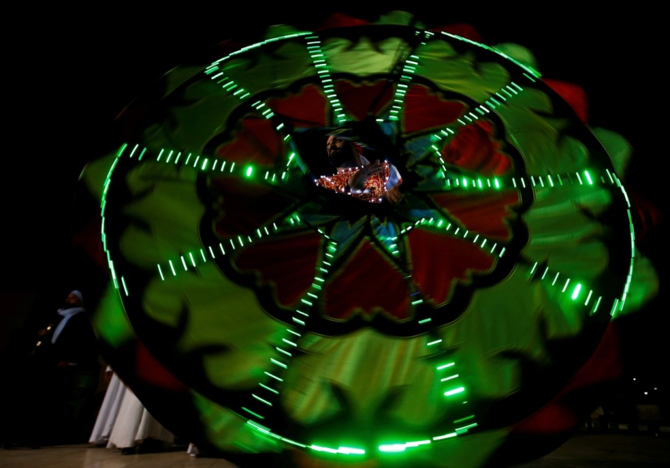 An Egyptian dancer performs the Tanoura, an Egyptian version of Sufi dance, during the holy fasting month of Ramadan in Cairo