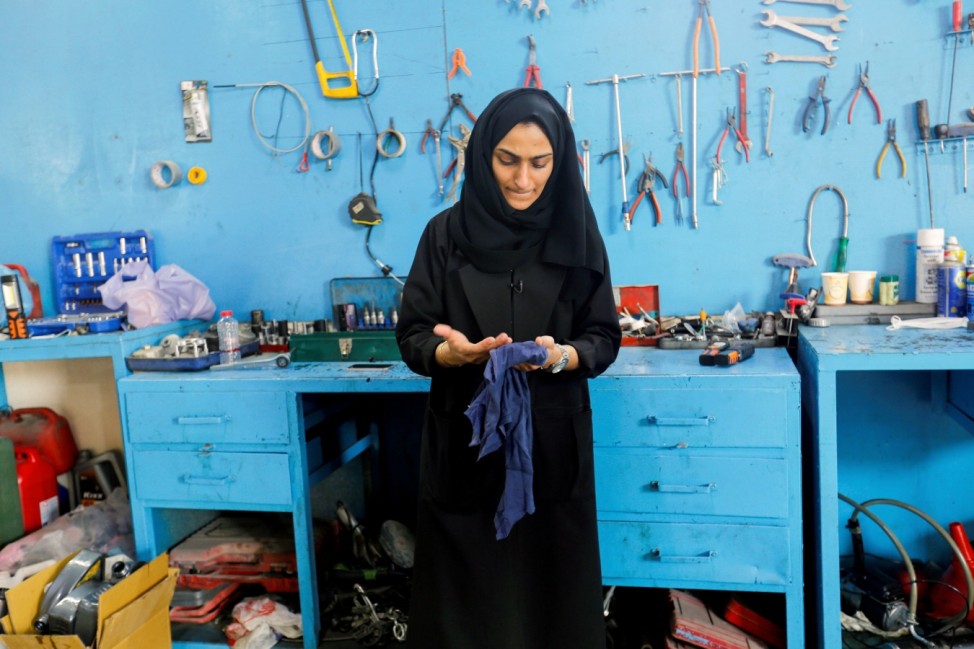 Huda al-Matrooshi, an Emirati woman who owns and runs a car repair garage in Sharjah