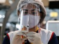 April 28, 2021, Bangkok, Thailand: A health worker prepares a dose of the CoronaVac (Sinovac) vaccine at Suvarnabhumi a