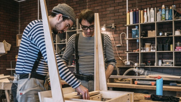 Carpenters at work on wooden table model released Symbolfoto property released PUBLICATIONxINxGERxSU