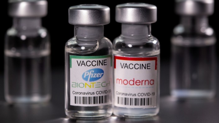 FILE PHOTO: Picture illustration of vials with Pfizer-BioNTech and Moderna coronavirus disease (COVID-19) vaccine labels