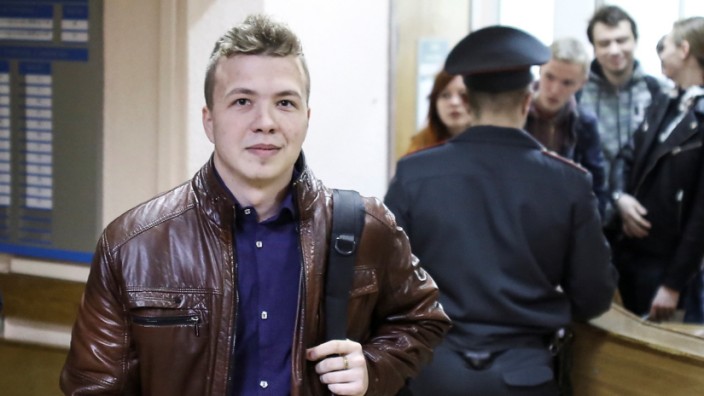 Opposition blogger and activist Roman Protasevich arrives for a court hearing in Minsk