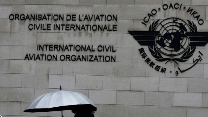 FILE PHOTO: A pedestrian walks past the International Civil Aviation Organization (ICAO) headquarters building in Montreal