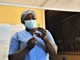 (210520) -- ACCRA, May 20, 2021 -- A medical worker prepares a dose of the COVID-19 vaccine at a hospital in Accra, cap