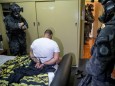 Person is detained by Australian Federal Police after its Operation Ironside against organised crime