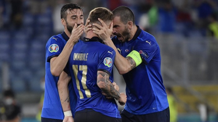 Ciro Immobile of Italy celebrates with Leonardo Bonucci and Bryan Cristante after scoring the goal of 3-0 during the UEF