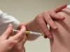 FILE PHOTO: A volunteer receives a dose of CureVac vaccine or a placebo, in Brussels