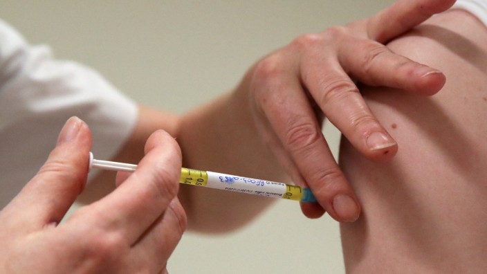 FILE PHOTO: A volunteer receives a dose of CureVac vaccine or a placebo, in Brussels