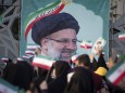 Iran Goes to the Polls in Presidential Election Supporters of the Iranian president elect Ebrahim Raisi wave Iran flags